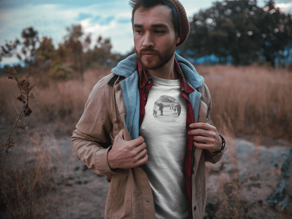 man wearing white tshirt with vintage photo or group skiing and the text vitamin ski