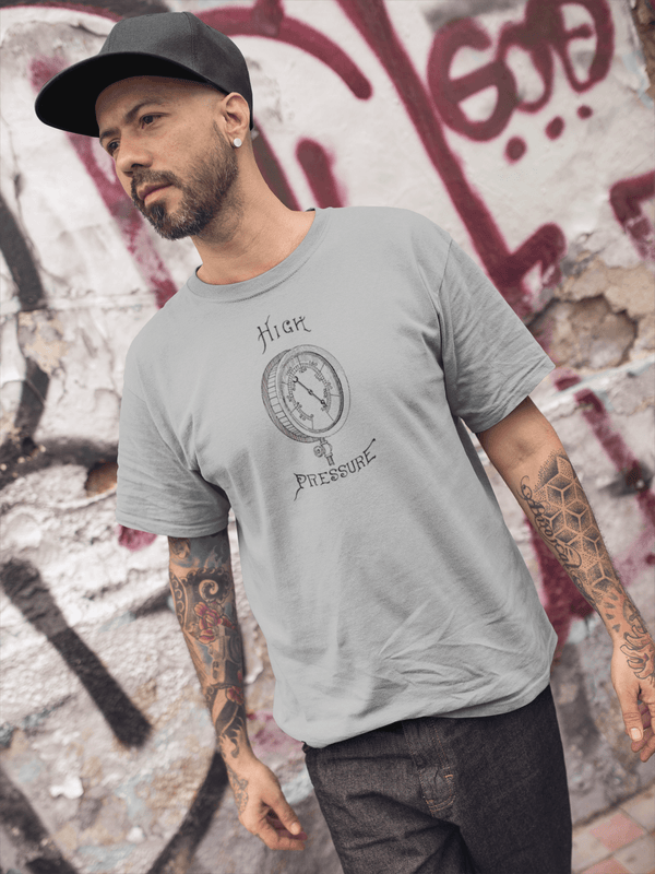 man in hat wearing heather grey mens tshirt with vintage graphic logo of pressure gauge and the text high pressure 