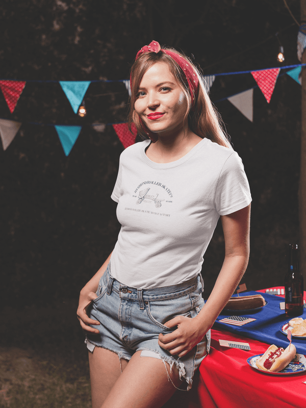 woman wearing white womens tshirt with vintage graphic logo of roller skate brand